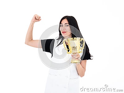 Caucasian winner girl proud while raise golden trophy victory prize after playoff challenge and show strong arm isolated on white Stock Photo