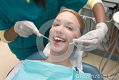 Caucasian woman and African-American dentist Stock Photo