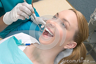 Caucasian woman and African-American dentist Stock Photo