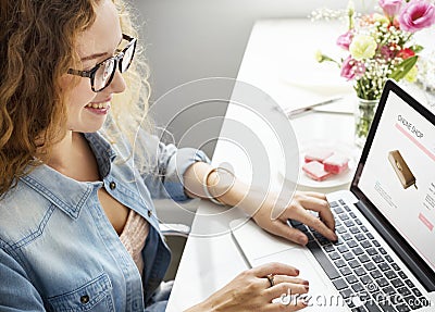 Caucasian woman creative shoot working on laptop Stock Photo