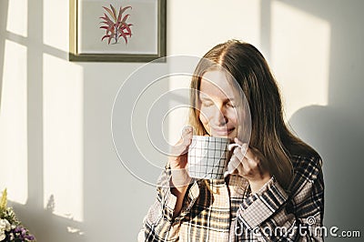 Caucasian woman drinks coffee in the morning Stock Photo