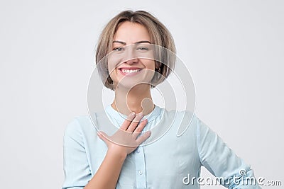 Caucasian woman wearing blue shirt smiling broadly glad to receive compliments from friends Stock Photo