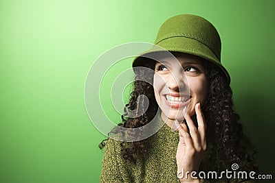 Caucasian woman wearing green clothing and hat. Stock Photo