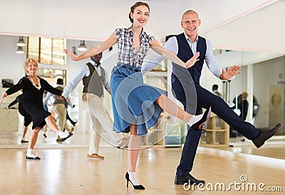 Woman and man dancing swing in studio Stock Photo