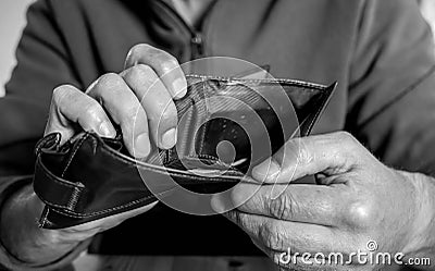 Caucasian worker with a missing finger showing hes empty wallet Stock Photo