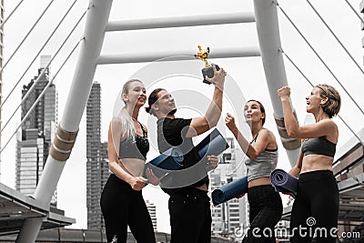 Caucasian yoga team celebration the winning trophy recieve from yoga competition championship Stock Photo
