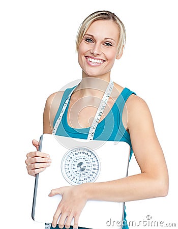 Caucasian young woman holding a weight scale Stock Photo