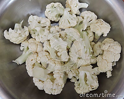 Cauliflower pieces kept in a container. Stock Photo