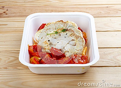 Cauliflower steak. Vegetarian food. Takeaway food. On a wooden background Stock Photo