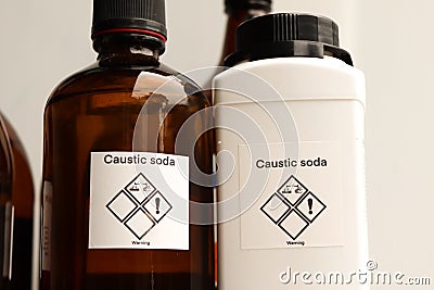 Caustic soda in bottle, chemical in the laboratory Stock Photo