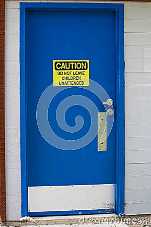 Caution do not leave children unattended sign on a bathroom door Stock Photo