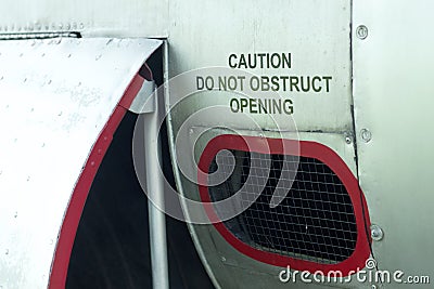 Caution do not obstruct opening decal on an old aircraft Stock Photo