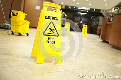 Caution lobby mop bucket and sign Stock Photo