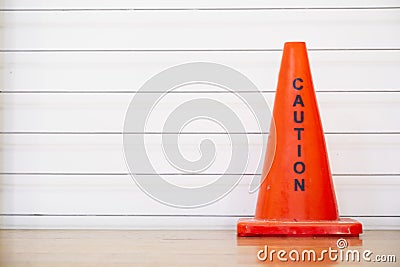 Caution red cone safety notice at workplace office stair Stock Photo