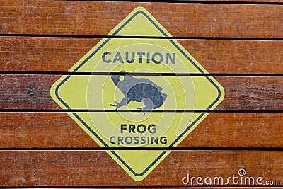 Caution sign, frogs crossing, in a zoo Stock Photo