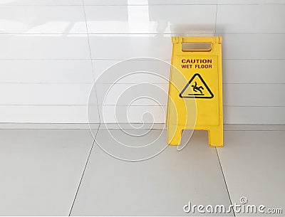 Caution yellow sign stated Stock Photo