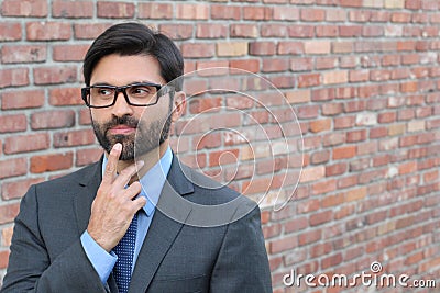 Cautious man taking a decision looking away with copy space Stock Photo