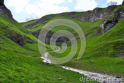 Cave Dale dry limestone hidden valley and stream, Peak District Stock Photo