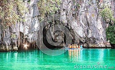 Cave entrance of Puerto Princesa subterranean underground river with longtail boat - Wanderlust travel concept at Palawan Editorial Stock Photo