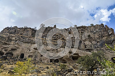 Cave houses and christian temples cut in pink tufa stone, Ihlara Valley, Cappadocia, gorge,Turkey Stock Photo