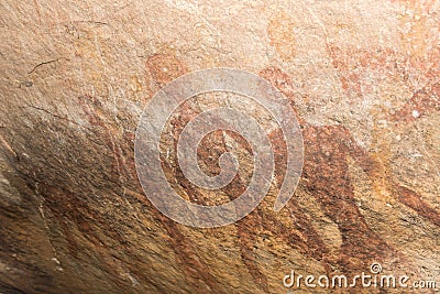 Cave paintings on the wall, painted ocher rock. prehistoric man, the primitive Neanderthal. the leader of the tribe, the shaman, p Stock Photo