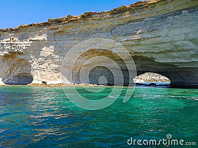 Cave passage with rocky seashore at Malta Stock Photo