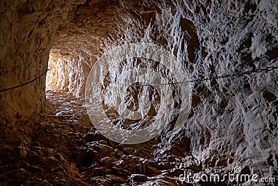 Cave rock tunnel through rock formation Stock Photo