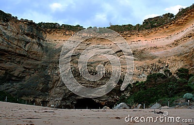 A cave in the rock wall of Loch Ard Gorge Stock Photo