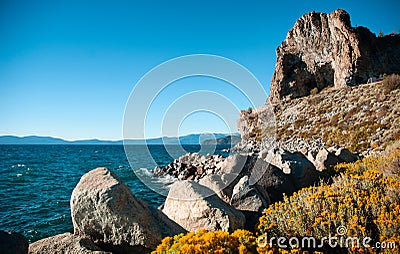 Cave rock and yellow sagebush of Lake Tahoe in Summer, Navada, U Stock Photo