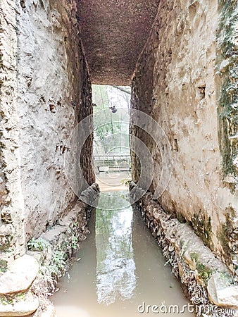 cave type structure in water at the rock garden in Chandigarh, India.Nek Chand established the garden in 1957 Stock Photo
