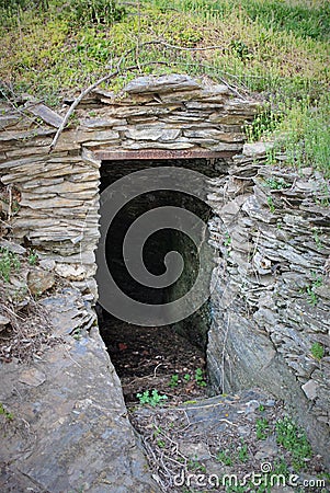 Cave under a hill Stock Photo