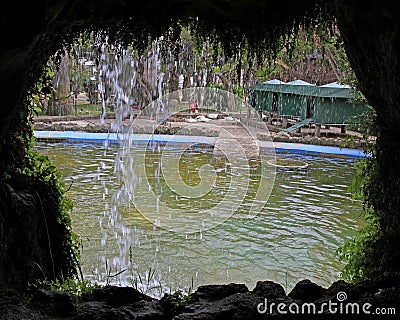 Cave and waterfall in Parque Genoves, Cadiz Editorial Stock Photo