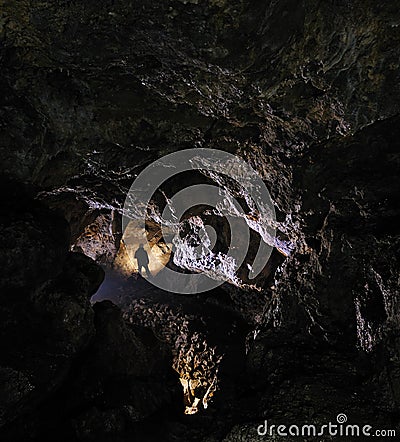 Caver in a cave Stock Photo