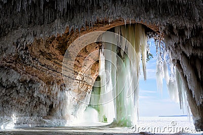 Cavern behind ice curtains on Grand Island on Lake Superior Stock Photo