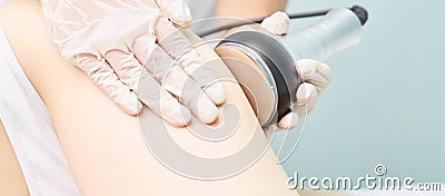 Cavitation rf body treatment. Female ultra sound lipo machine. Spa contouring. Doctor hands Stock Photo