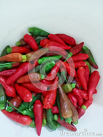 Cayenne pepper red green orange, pink, faded orange, hot cayenne pepper without pesticides Stock Photo