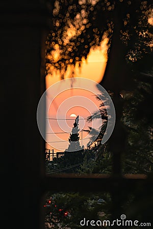 Ccenic view of a residential home's window during sunset Editorial Stock Photo