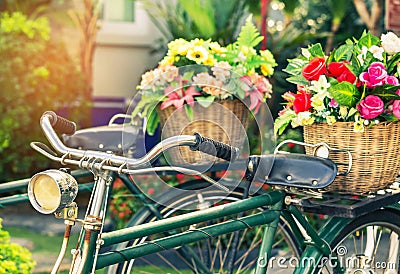 Cclose up vintage bicycle with bouquet flowers in basket Stock Photo