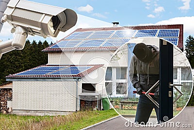 CCTV Camera Showing Burglar Trying To Open A Door Stock Photo