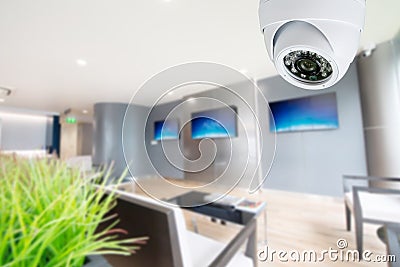 CCTV Security Camera monitoring your place Stock Photo