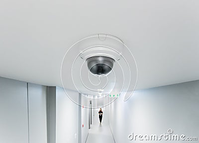 CCTV or surveillance operating in walkway office building blur b Stock Photo