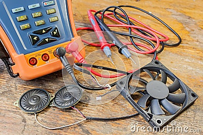 CCTV tester with probes, CPU fan and loudspeakers on a table in a workshop Stock Photo