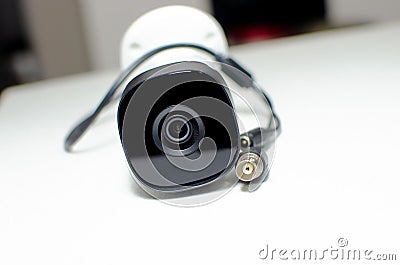 CCTV videocam, CFTV security camera, white camera with secure circuit, theft protection surveillance Stock Photo