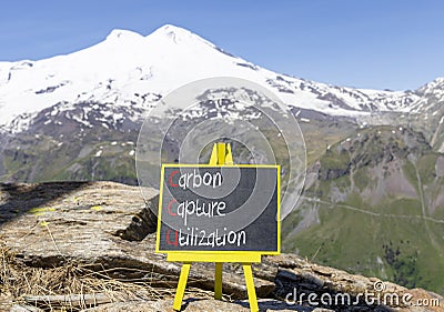 CCU Carbon capture utilization symbol Concept words CCU Carbon capture utilization on beautiful blackboard Beautiful Elbrus Stock Photo