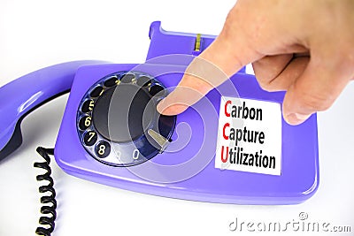 CCU Carbon capture utilization symbol. Concept words CCU Carbon capture utilization on old disk phone. Beautiful white background Stock Photo