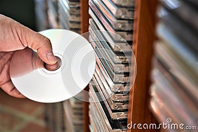 Cd in hand Stock Photo