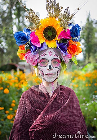 Vertical portrait of a female in La Calavera Catrina make up on the day of the dead, Mexico Editorial Stock Photo