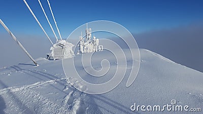 Ceahlau weather station in winter landscape. Stock Photo