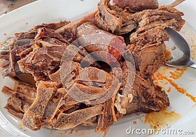 Cecina de chivo, dried goat meat cooked in the oven with red sausage, typical meal in the north of Leon province, Spain Stock Photo