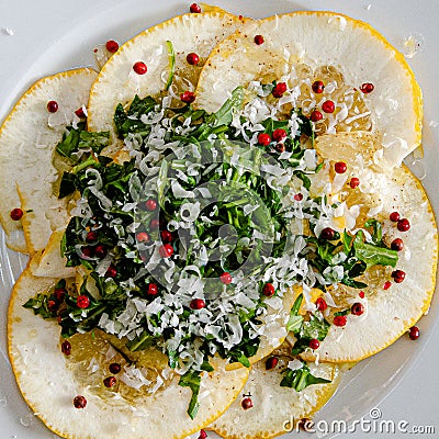 Cedri, a citrus fruit with rucola, red berries, grated parmesan cheese in high quality olive oil Stock Photo